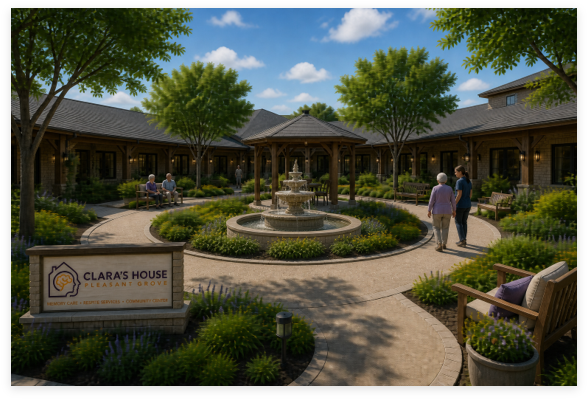Landscaped courtyard with a central fountain, covered walkway, and seating